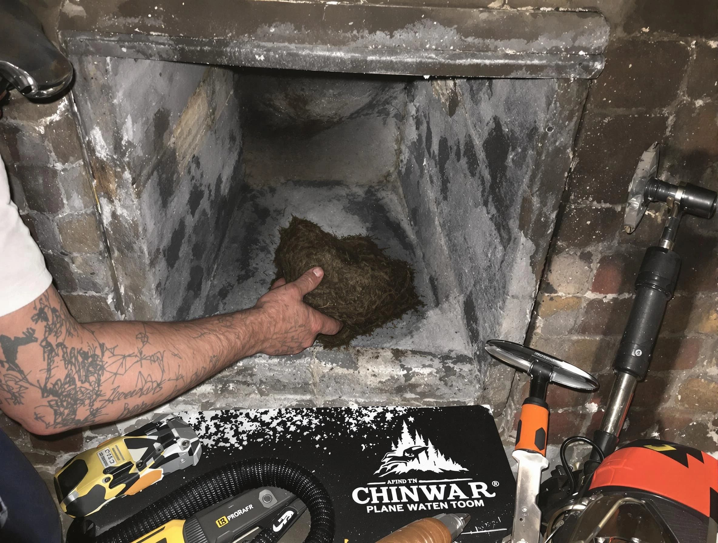 Shrewsbury Chimney Sweep safely removing debris and screening chimney in Shrewsbury, MA
